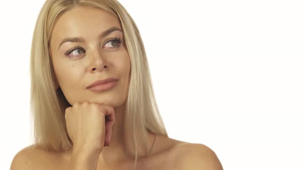 The Incredibly Beautiful Girl Thoughtfully Standing Against a White Wall alt