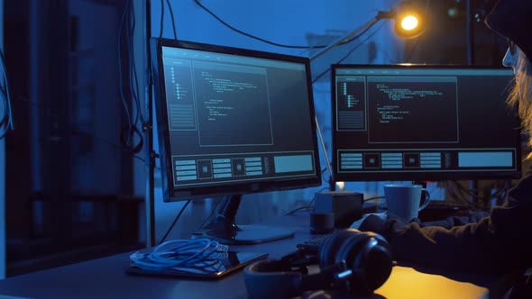 Hacker Creating Computer Virus for Cyber Attack  alt