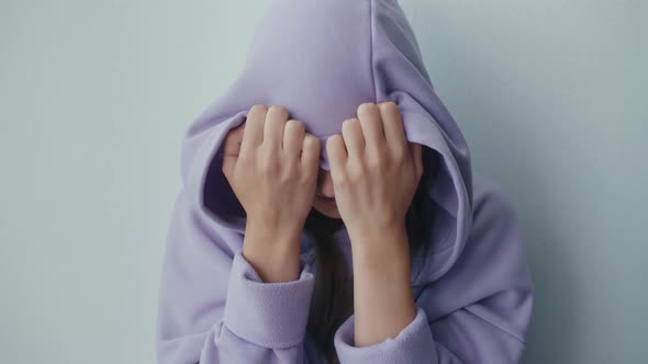 Unhappy Depressed Teenager Girl Wears Hood Sits Alone Thinking of Problem alt