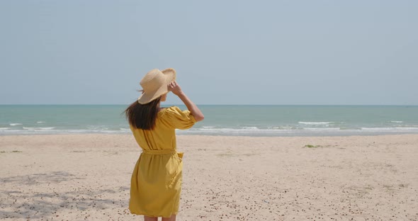 Woman travel and look at the sea