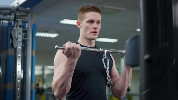 Confident Handsome Young Caucasian Man Training in Gym Lifting Resistance Weights alt