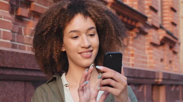 Young African Female Travel Blogger Walking in Center of City Seeing Sights Admiring Contemporary alt