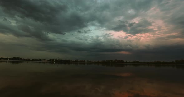 Dramatic Clouds Over the River Sunset Timelapse