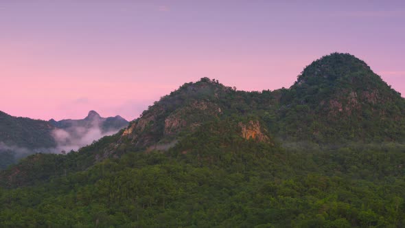 Beautiful aerial view sea of fog in the morning forest with green mountains. alt