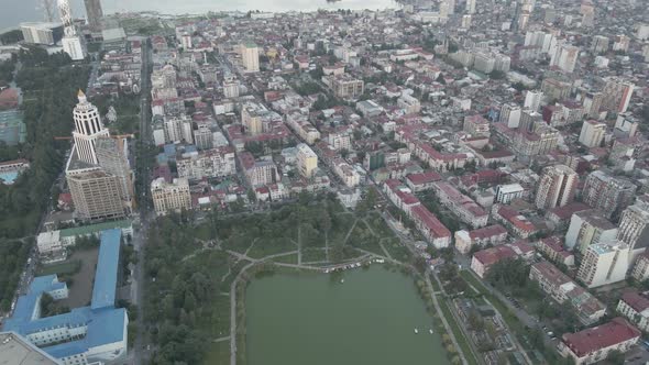 Top aerial view of beautiful lake in the center of Batumi. flying over 6 May park. Georgia alt