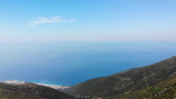 Aerial View From Llogara Pass to Albanian Riviera Beach Clouds and Ionian Sea Coastline
