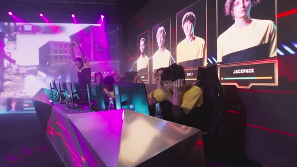 Cyber Sportsmen Hugging and Celebrating Victory alt