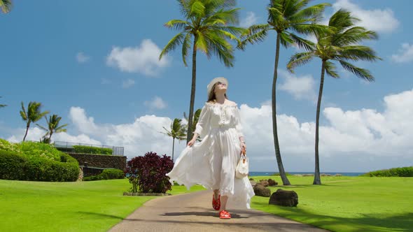 Slow Motion Beautiful Smiling Woman in Flying White Dress Walking Hawaii Island alt