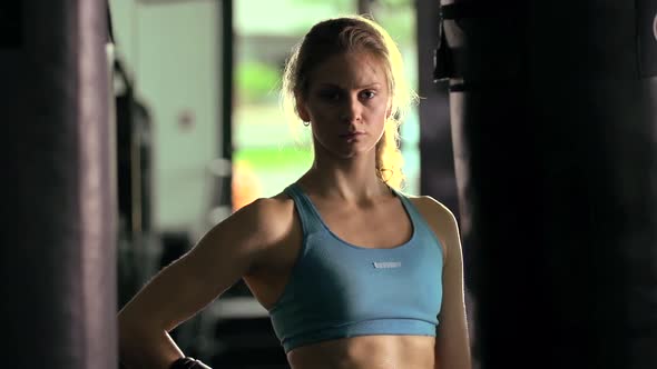 Portrait of a woman before doing Muay Thai kickboxing training at the gym alt