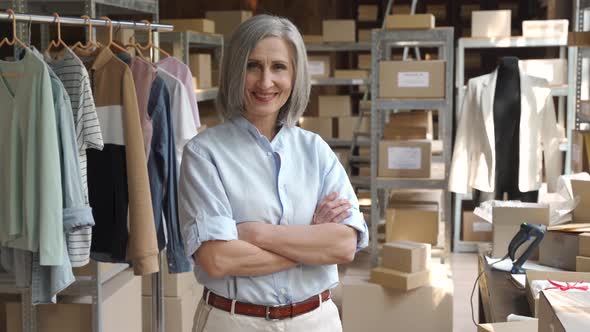 Female Entrepreneur Clothing Store Business Owner in Warehouse Portrait alt