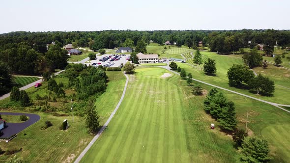 4K Aerial View of Drone fly over of the 18th Hole Leading To Clubhouse alt