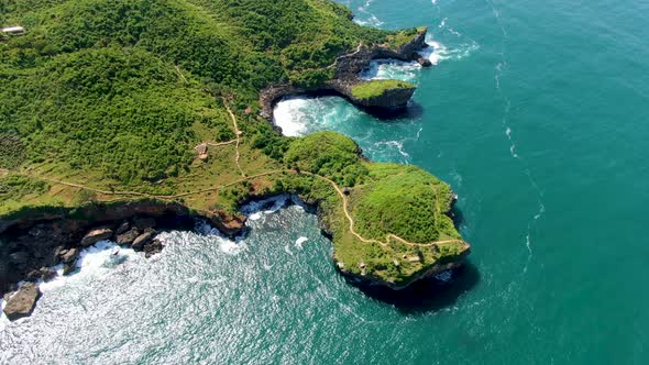 Cliffs, headlands and bays of Kesirat Beach, Yogyakarta, Indonesia aerial view alt