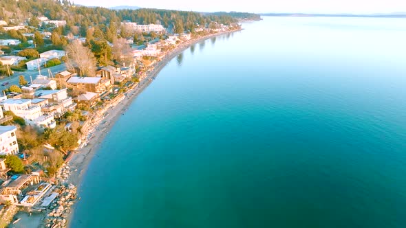 Cordova Bay in Victoria, BC at Sunrise. Calm waters and beautiful beach houses. alt
