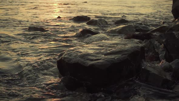 Splashes of Water From a Wave on a Stony Shore 