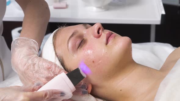 Woman Receiving Ultrasound Cavitation Facial Peeling