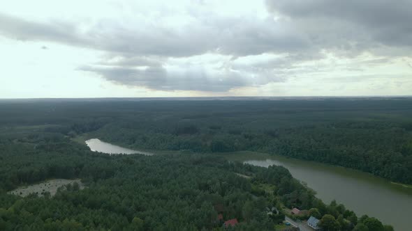 River winding in lowland covered with dense forest. Baltic mixed forest ecoregion alt