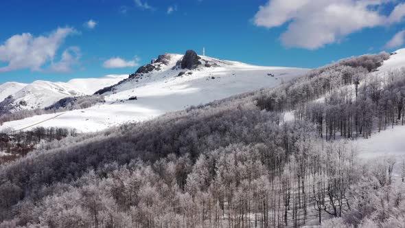 Aerial view at the mountain on a sunny winter day