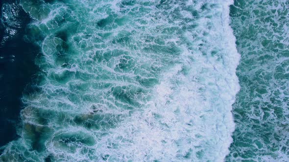 Beautiful top view sea waves ripples. 4K video Aerial view in drone. Wave in the seawater Summer sun alt
