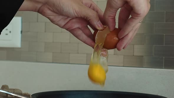 Slow Motion of Falling Egg Into Frying Pan Footage Food
