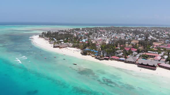 Aerial Coastline of Paradise Beach and Clear Water Over Reef in Ocean Zanzibar alt