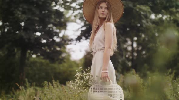 Woman with Flowers in Nature in the Summer alt