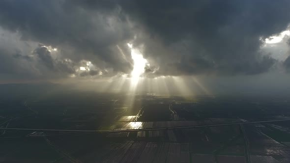 Sun Beam Through the Storm Clouds alt
