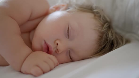 Peaceful Baby Boy Sleeping Bed in Room alt