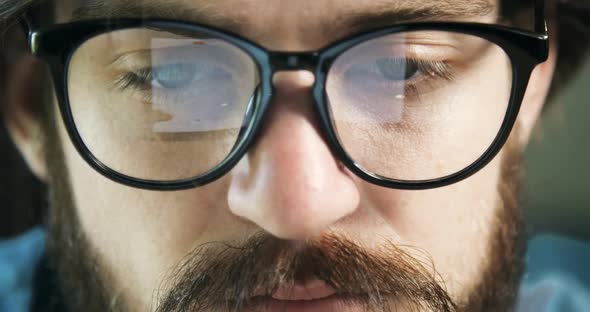 Student in Eyeglasses Using Tablet