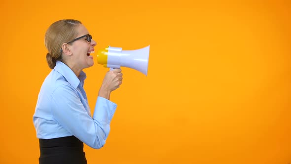 Angry Business Woman Shouting in Megaphone on Orange Background, Leadership alt