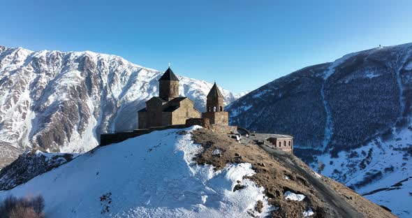 Aerial view of Gergeti Trinity Church, Tsminda Sameba in Kazbegi. Georgia 2022 alt