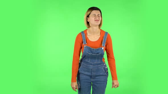 Woman Looking at Camera with Anticipation, Then Very Upset. Green Screen alt