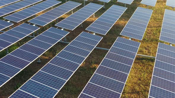 Aerial drone view flight over solar panels power station alt