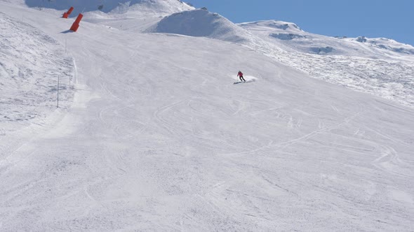 Skier Fast Slides Down Slalom On Snowy Slope In Mountains In Winter On Ski alt