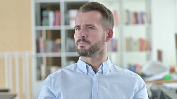 Portrait of Curious Young Man Searching for Opportunity alt