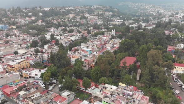 Aerial panoramic view of Barrio La Concepción at southern Mexico City. Drone flying forward and desc alt