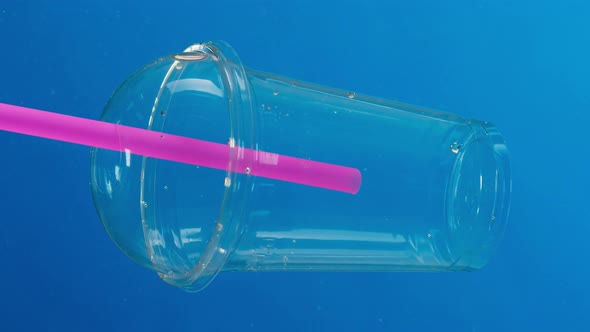 Plastic Trash in Ocean Water Sea Pollution Caps and Glasses Ecology Problems Waste and Garbage alt