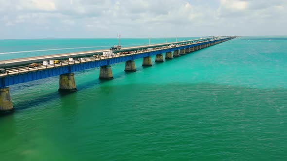 Old Bridge Running Over Ocean Surface Next to Operating One in Florida Keys USA alt