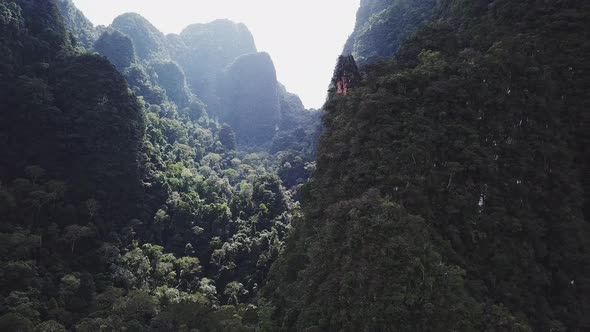 An Aerial View From a Drone Flying From Mountains Over Jungle Rainforest in Thailand