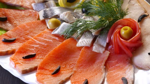 Seafood on Plate  Salmon Herring Fish and Sliced Fish Fillet