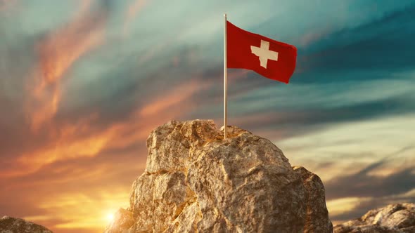 Waving Swiss Flag On Rocky Landscape