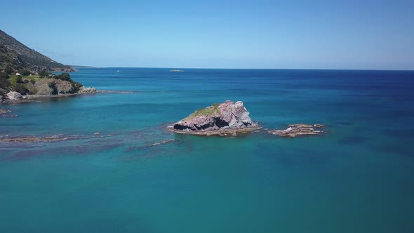 Drone Is Flying Over Beautiful Rocks in Water of Mediterranean Sea Near Shore, Top View