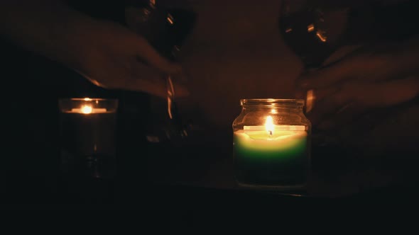 The Guy and the Girl Drink Wine By Candlelight in the Evening Near the Bed alt