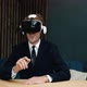 Handsome Excites Caucasian Businessman is Wearing Virtual Reality Headset at Home