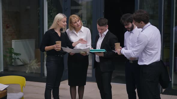 Wide Shot Group Intelligent Business People Discussing Startup Project Standing on Office Terrace on alt