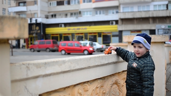  Kid Playing With Car Toy Near Car Traffic 02