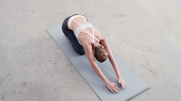 Woman Stretching in Yoga Pose