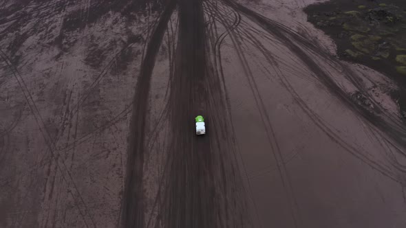 Aerial View of Road Surrounded By Volcanic Lava alt