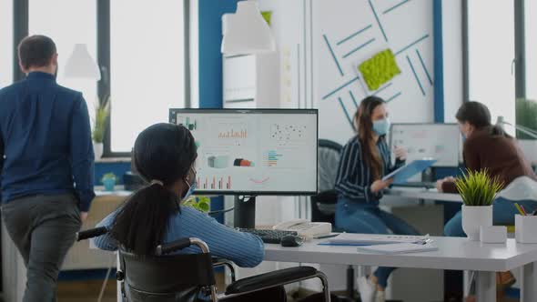 Company Team Checking Financial Graphics Wearing Protective Face Mask alt