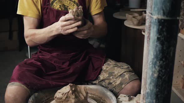 Serious Woman Working at Pottery Wheel in Studio Prepare Clay to Make Plate to Restaurant alt