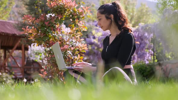 Attractive Young Woman Using Laptop alt